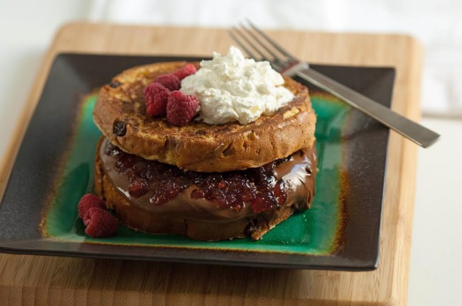 Nutella Stuffed Panettone French Toast | FOODIEaholic.com #recipe #cooking #breakfast #brunch #frenchtoast #nutella #stuffed #raspberry #panettone